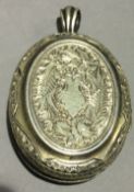 A Victorian white metal locket