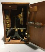 A Victorian brass cased monocular microscope