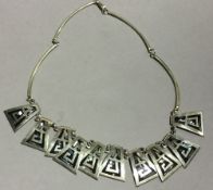 A silver and abalone shell necklace