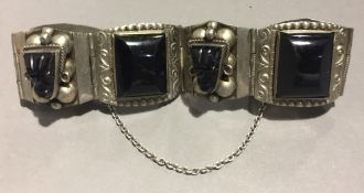 A silver and onyx bracelet