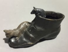 A bronze model of a cat and a mouse in a boot