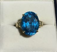 A 9 ct gold blue topaz ring