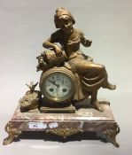 A Victorian figurally mounted marble mantle clock