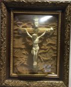 A bow front glazed and framed crucifix