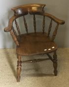 A Victorian smokers bow armchair