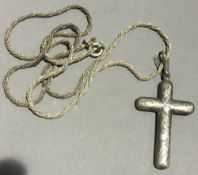 A Victorian silver crucifix on a silver chain