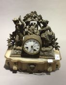 A Victorian figurally mounted mantle clock