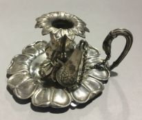 A small silver chamberstick