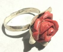 A silver and coral ring