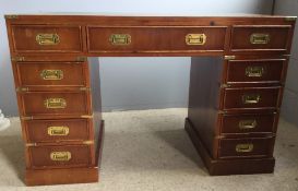 A reproduction campaign style pedestal desk