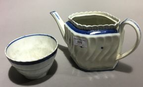 An 18th century porcelain teapot and bowl