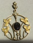 A 9 ct gold and garnet pendant