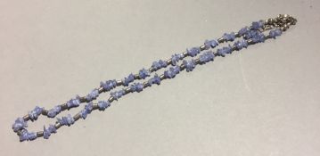 A silver and tanzanite necklet