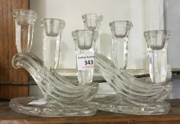 A pair of glass candlesticks