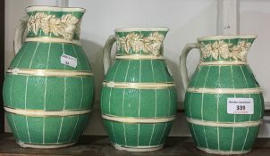 A graduated set of three Staffordshire Cobridge ware jugs