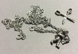 Three sterling silver chains and two white metal novelty charms (13 grammes all in)