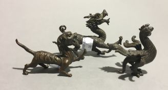 Three bronze mythical beasts