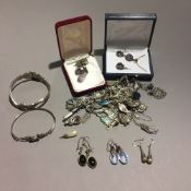 A quantity of silver jewellery, including amethyst set pendants, chains,