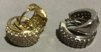 A pair of 9 ct gold earrings and another pair