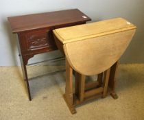 A small oak drop flap table and a shoe rack