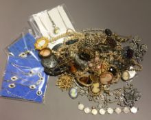 A quantity of costume jewellery, including chains, cameos, pearl necklaces, etc.