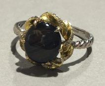 An 18 ct gold star sapphire and diamond ring (4 grammes all in)