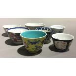 A small collection of porcelain tea bowls