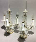 A pair of glass gilt metal mounted candelabra,