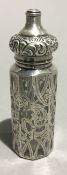 A silver overlay scent bottle