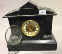 A Victorian black marble mantle clock