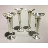 Four silver bud vases