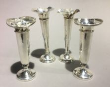 Four silver bud vases