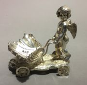 A silver plated cherub form salt