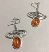 A pair of Art Nouveau style silver earrings