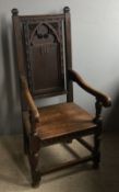 A Victorian carved oak open armchair