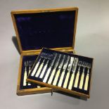 A cased set of silver and ivory fish knives and forks