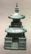 A Chinese celadon ground pagoda form censer