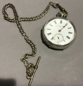 A silver pocket watch on a chain