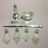 A silver mounted butter dish, a silver sifter, a silver paper knife,