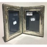 A hallmarked silver double photo frame