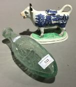 A Victorian Staffordshire cow creamer and a Victorian cod bottle