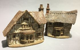 Two ceramic model cottages