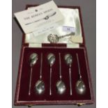 A set of six silver teaspoons and a caddy spoon