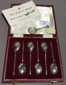 A set of six silver teaspoons and a caddy spoon