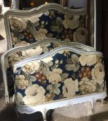 A pair of late 19th/early 20th century French painted single beds