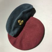 A WWII red beret with flight officer's car badge,