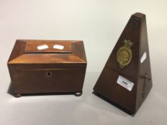 A 19th century walnut tea caddy together with a metronome in oak case, Maezel,