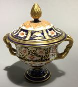 A Crown Derby twin-handled vase and cover