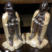 A pair of knight form fireside ornaments