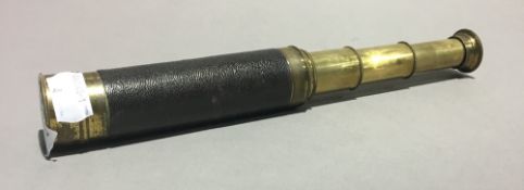 A small leather bound three drawer brass telescope